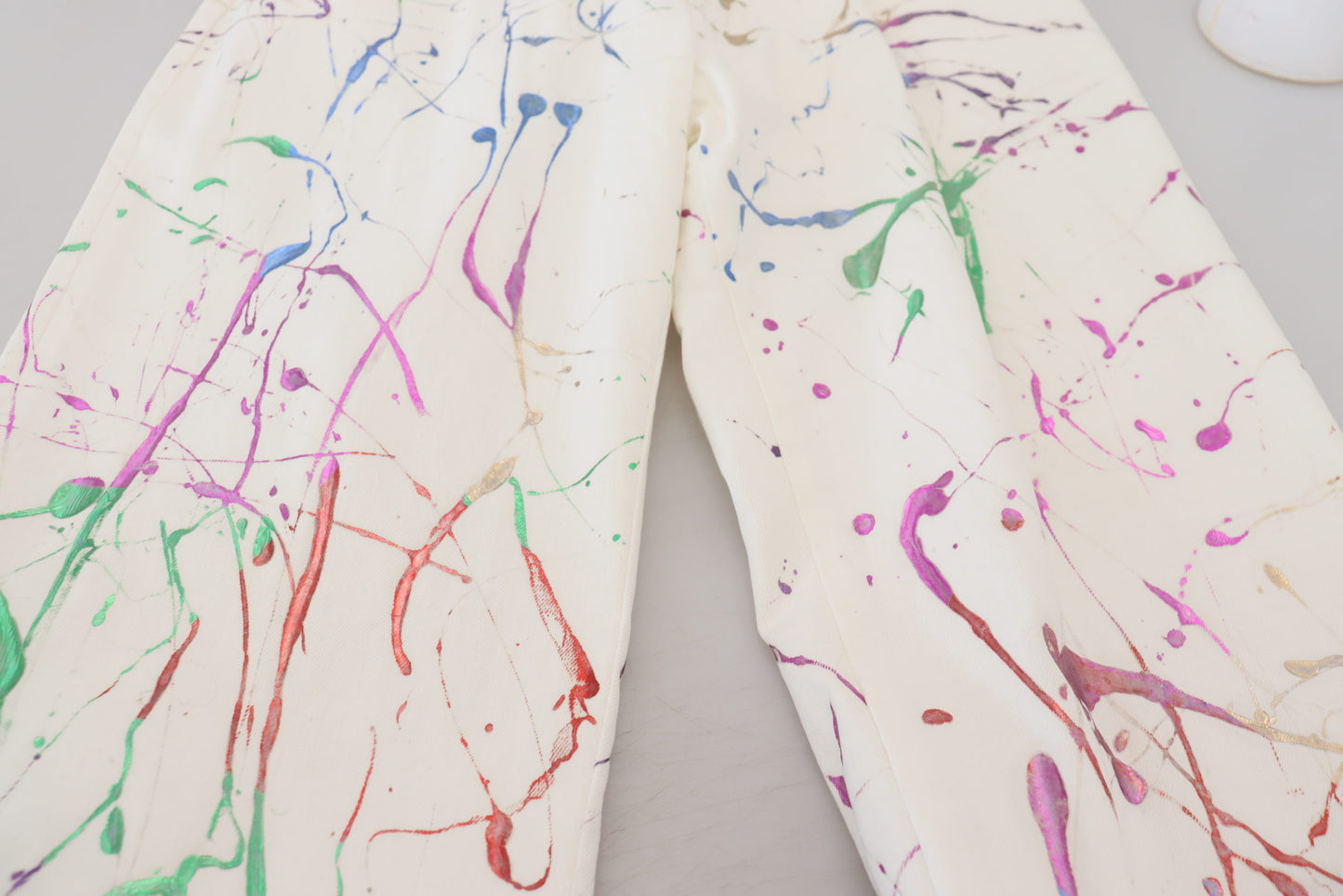 Pantaloni in denim con stampa Splash di colore bianco in cotone