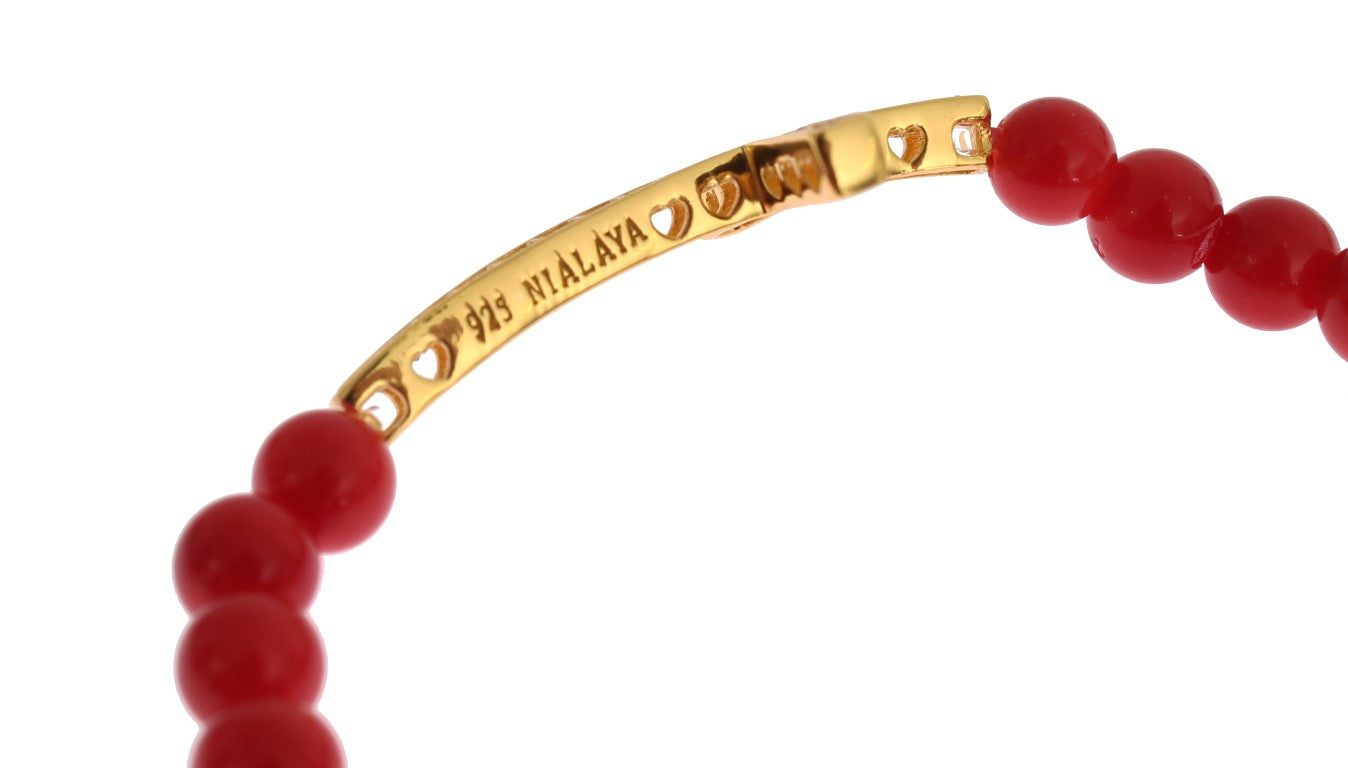 Pulsera de plata 925 con cruz de circonitas doradas y coral rojo